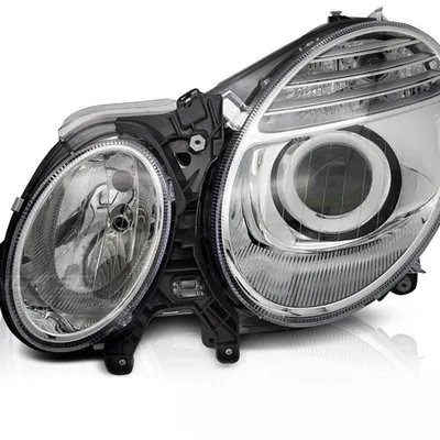 Lampa lewa reflektor TYC do Mercedes W211 06-09